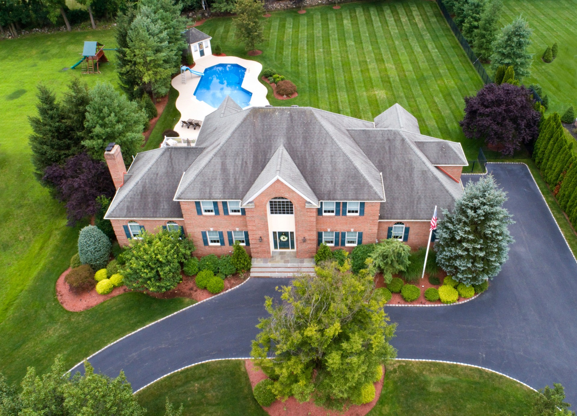 Large estate and property aerial, looking down at front of house.